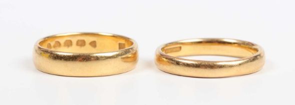 A Victorian 22ct gold wedding ring, London 1882, ring size approx M1/2, and another 22ct gold