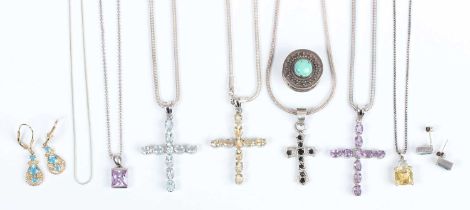 A small group of jewellery, including four silver and gem set pendant crosses, each detailed ‘