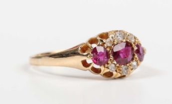 An Edwardian 18ct gold, ruby and diamond ring, mounted with three rubies and six variously cut
