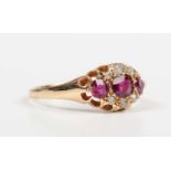 An Edwardian 18ct gold, ruby and diamond ring, mounted with three rubies and six variously cut