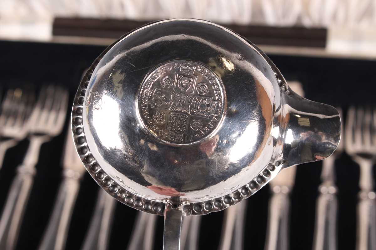 A set of six silver handled fish knives and forks, Sheffield 1934, cased, together with a George - Image 4 of 6