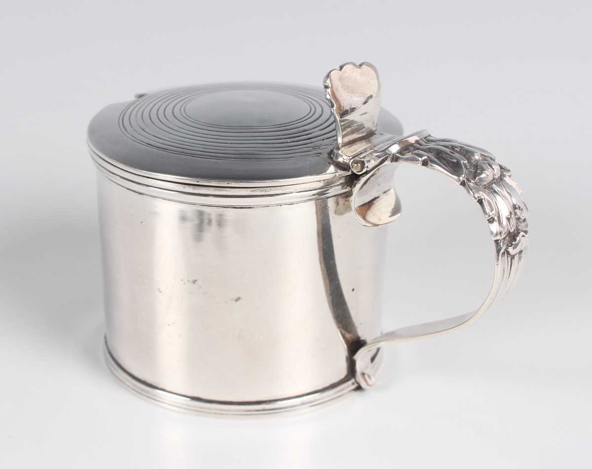 A George IV silver mustard of cylindrical form with hinged lid and foliate capped scroll handle, - Image 2 of 3