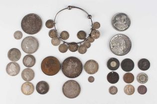 A small collection of various British coinage, including a George III shilling 1787, a Victoria