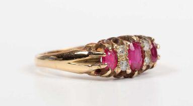 An 18ct gold, diamond and synthetic ruby ring, mounted with three oval cut synthetic rubies and