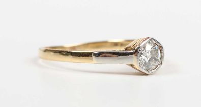 A gold, platinum and diamond single stone ring, mounted with a circular cut diamond in a hexagonal