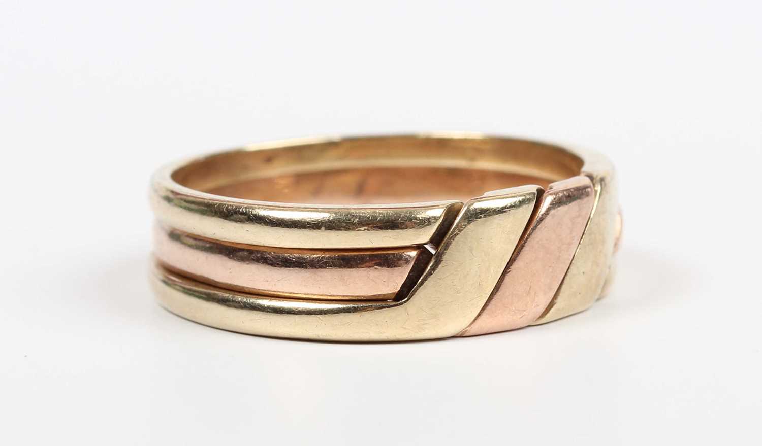 A 9ct three colour gold three section puzzle ring, weight 6.9g, ring size approx V1/2.