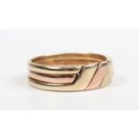 A 9ct three colour gold three section puzzle ring, weight 6.9g, ring size approx V1/2.