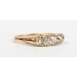 A gold and diamond five stone ring, mounted with a row of old cut diamonds graduating in size to the