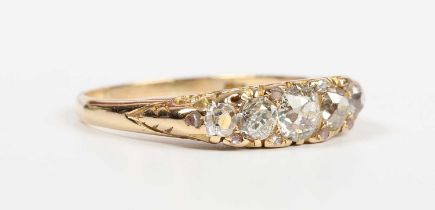 A gold and diamond five stone ring, mounted with a row of old cut diamonds graduating in size to the