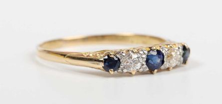 A gold, sapphire and diamond ring, mounted with three sapphires alternating with two old cut