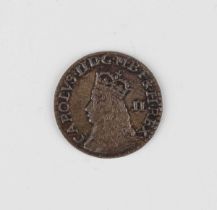A Charles II third issue penny, mintmark crown (extremely fine, toned with some rainbowing).