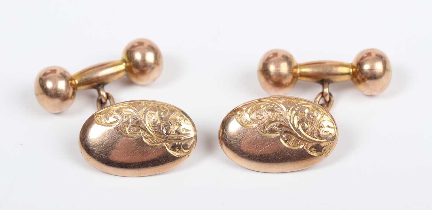 A pair of 9ct gold cufflinks, each oval front with engraved decoration, with dumbbell shaped - Image 2 of 3