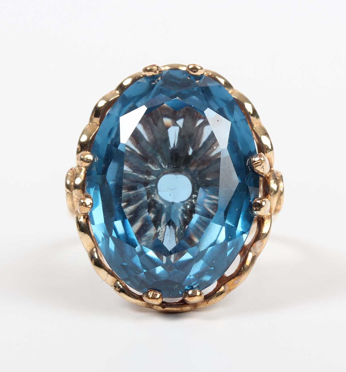 A 9ct gold ring, claw set with a large oval cut synthetic blue spinel, London 2009, weight 9g, - Image 2 of 5