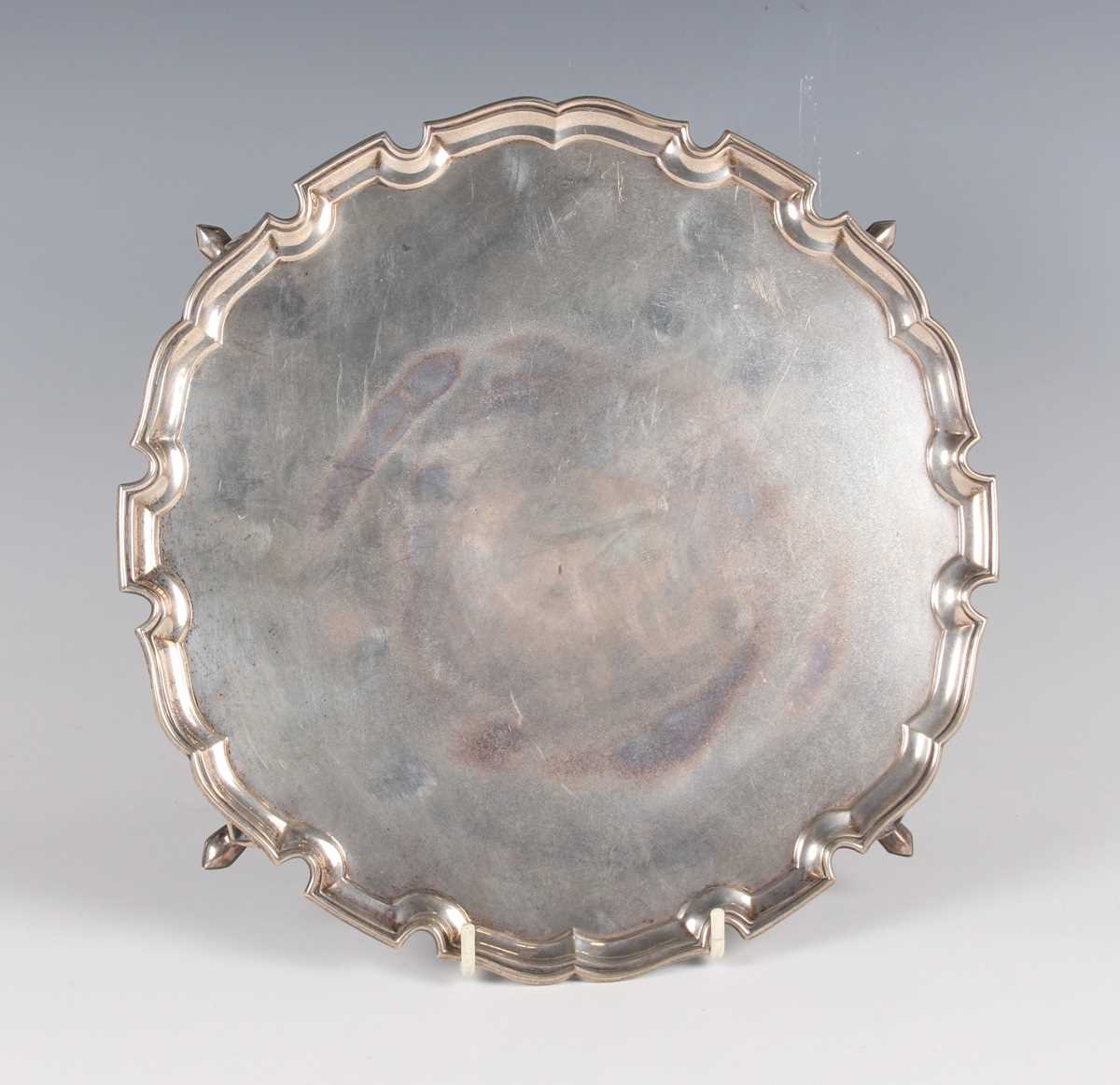 A George VI silver salver with piecrust rim, London 1938 by the Goldsmiths & Silversmiths Co Ltd,