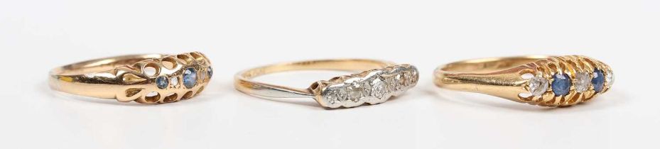 A gold, platinum and diamond ring, mounted with a graduated row of circular cut diamonds,