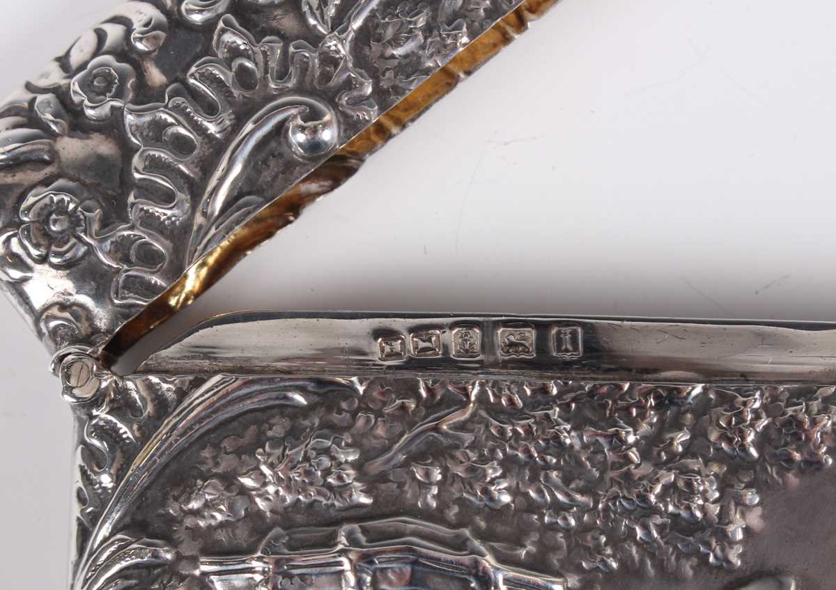 An Edwardian silver rectangular card case, the front decorated in relief with a musician and two - Image 3 of 3