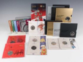 A collection of Elizabeth II Royal Mint Brilliant Uncirculated commemorative coins, including HM The