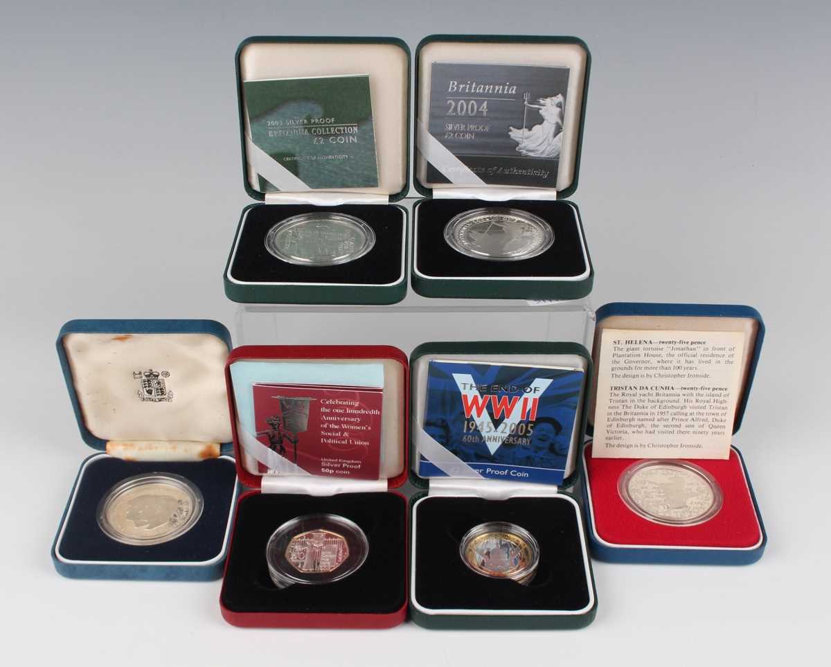 A group of six Elizabeth II Royal Mint silver proof commemorative coins, including Britannia two