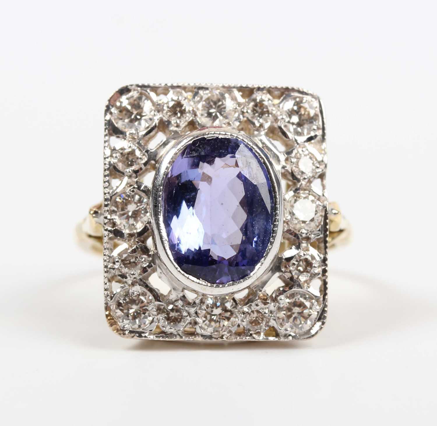 A gold, tanzanite and diamond panel shaped ring, collet set with the oval cut tanzanite within a - Image 2 of 5