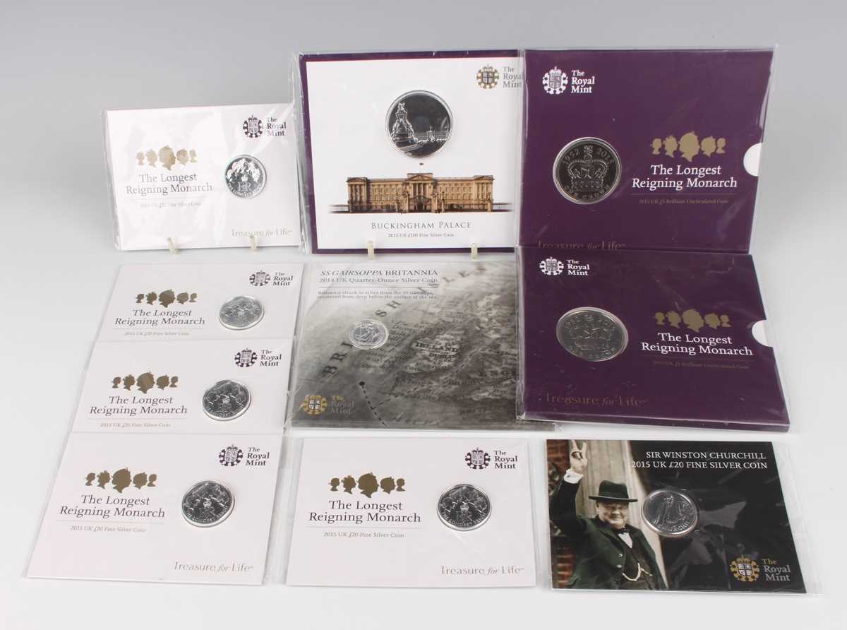 A small group of Elizabeth II Royal Mint silver and base metal commemorative coins, including five