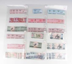 A collection of approximately one hundred and fifty mid to late 20th century North Korean banknotes,