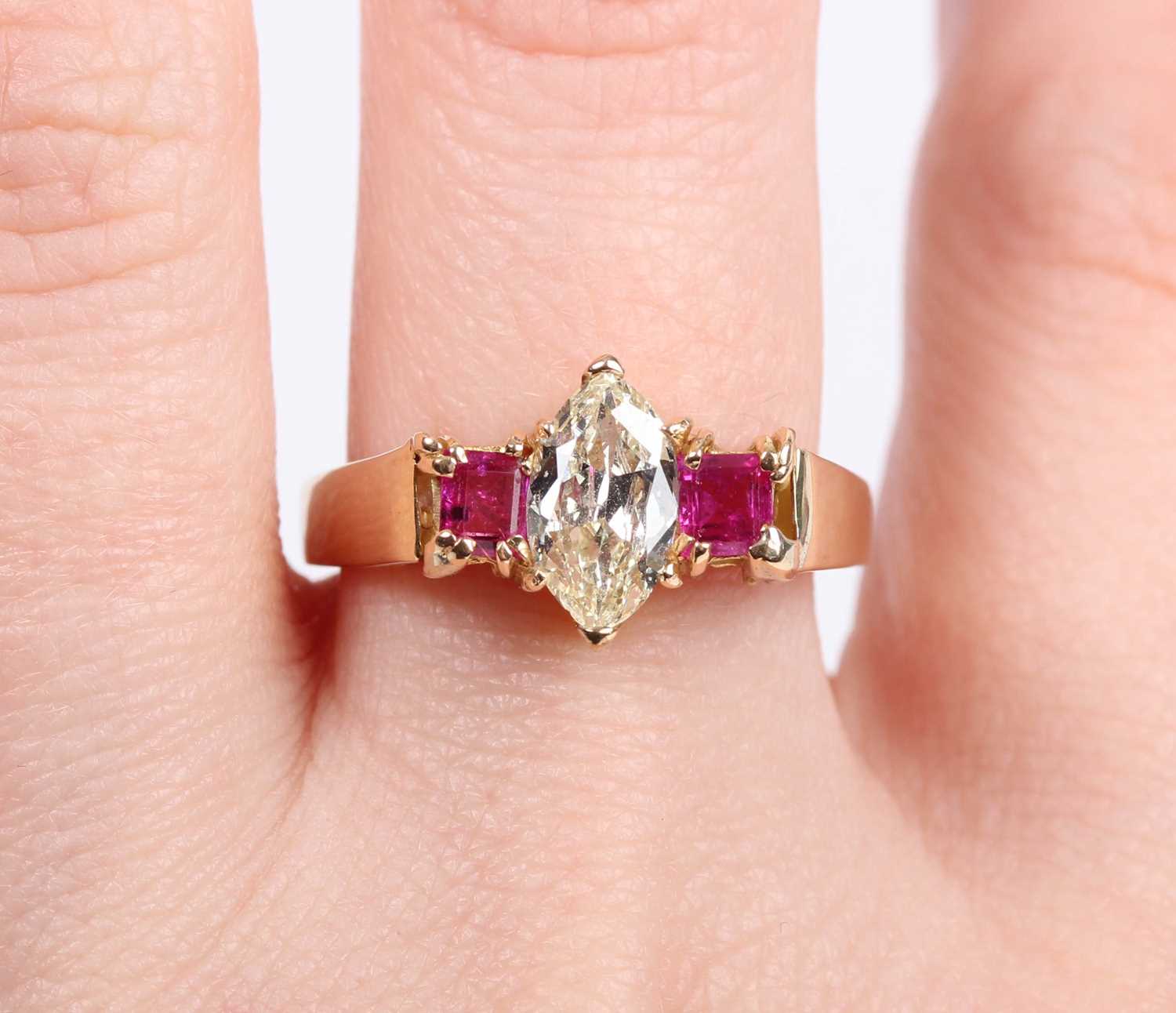 A gold, diamond and ruby ring, claw set with the marquise shaped diamond between two square cut - Image 5 of 5