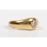 A gold and diamond single stone ring, gypsy set with an old cut diamond, traces of inscription