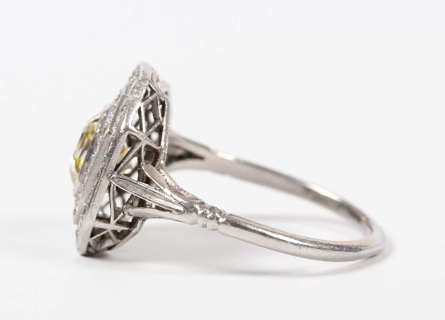 A platinum, fancy intense yellow diamond and diamond ring, mounted with the asscher cut fancy - Image 3 of 6