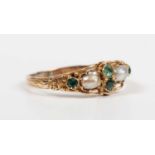 A gold, emerald, green gem and half-pearl ring, mounted with two half-pearls and four variously