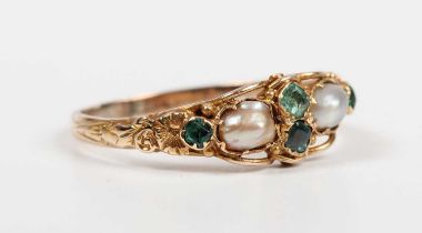 A gold, emerald, green gem and half-pearl ring, mounted with two half-pearls and four variously