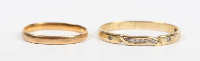 An Egyptian gold and diamond band ring, weight 2.1g, and a gold wedding ring, detailed ‘22ct’,