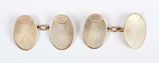 A pair of 9ct gold oval cufflinks with engine turned decoration, London 1947, weight 5.4g,
