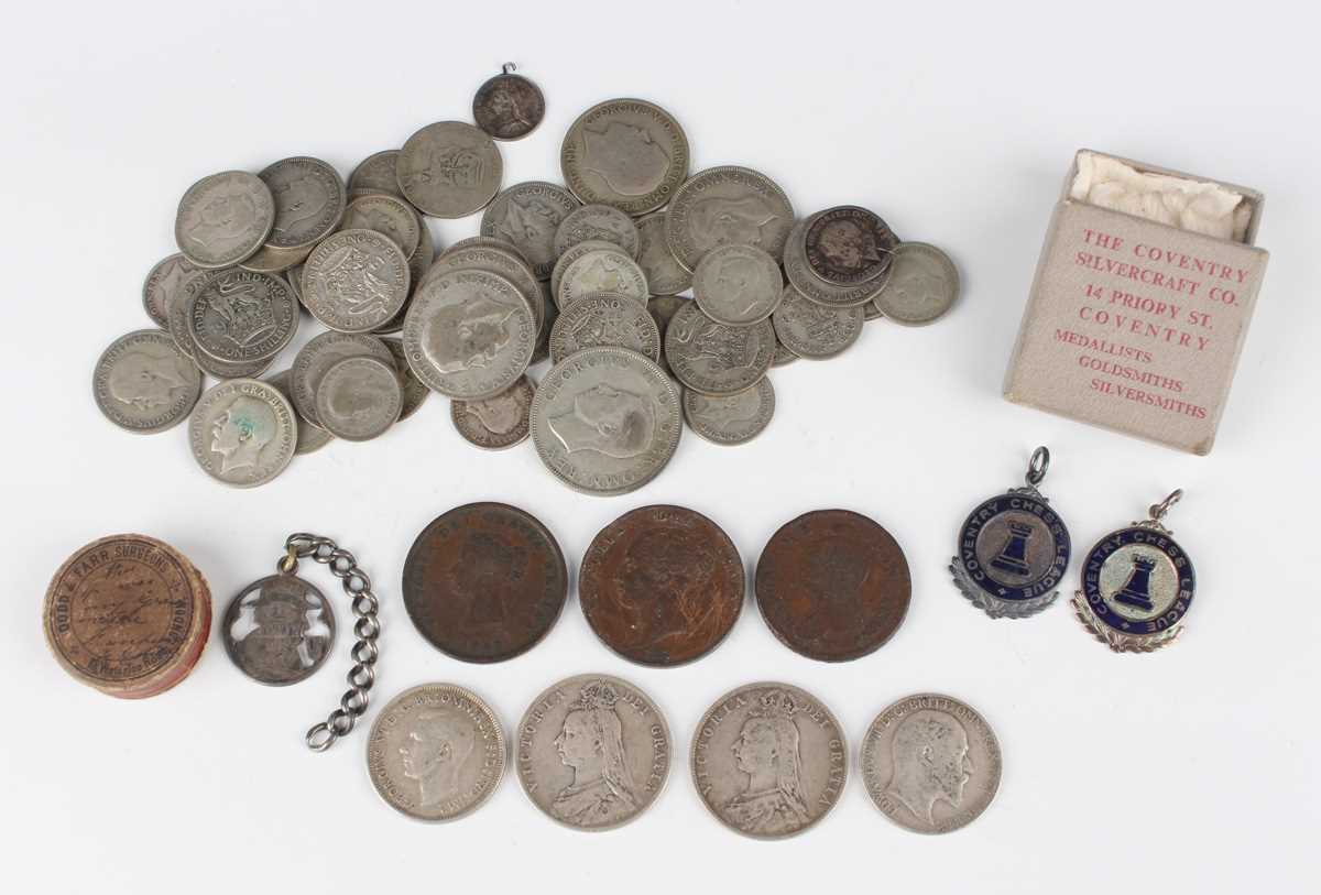 A small collection of coins, including a group of pre-1947 British silver and silver nickel coinage,