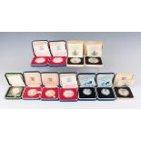 A group of eleven Elizabeth II Royal Mint silver proof commemorative crowns, including Silver