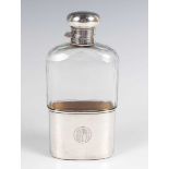 An Edwardian silver mounted faceted cut glass hip flask with detachable cup, London 1904 by