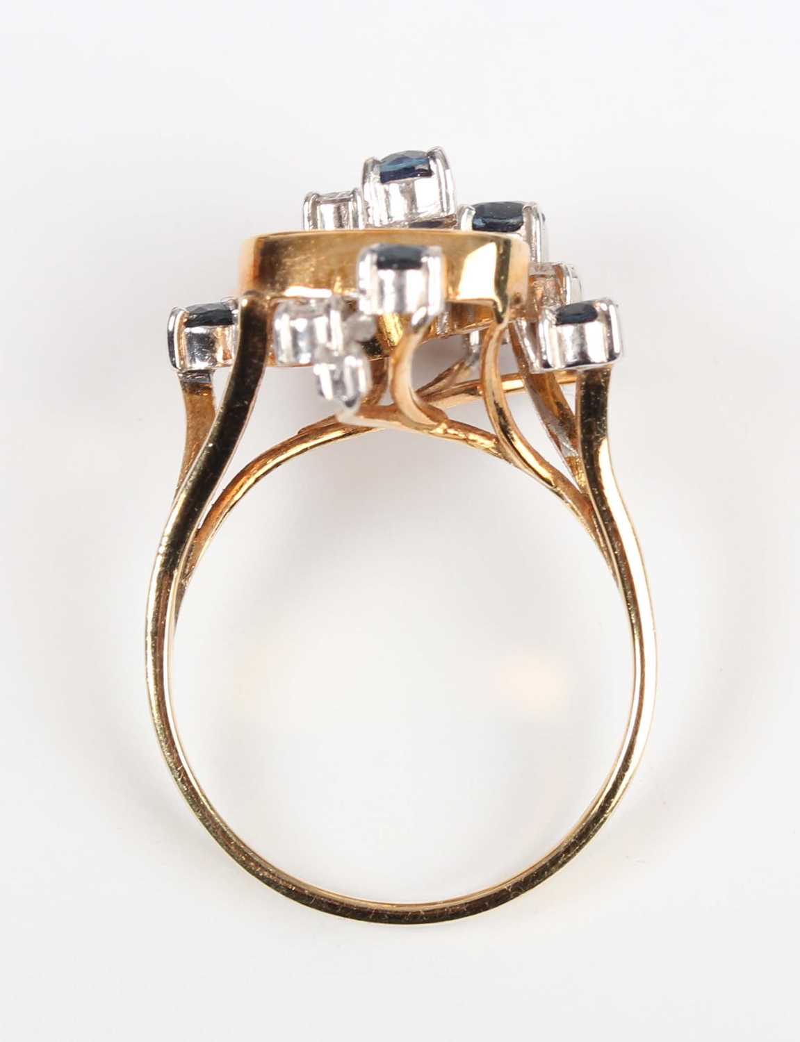 A gold, sapphire and diamond ring in an abstract design, claw set with five circular cut - Image 4 of 5