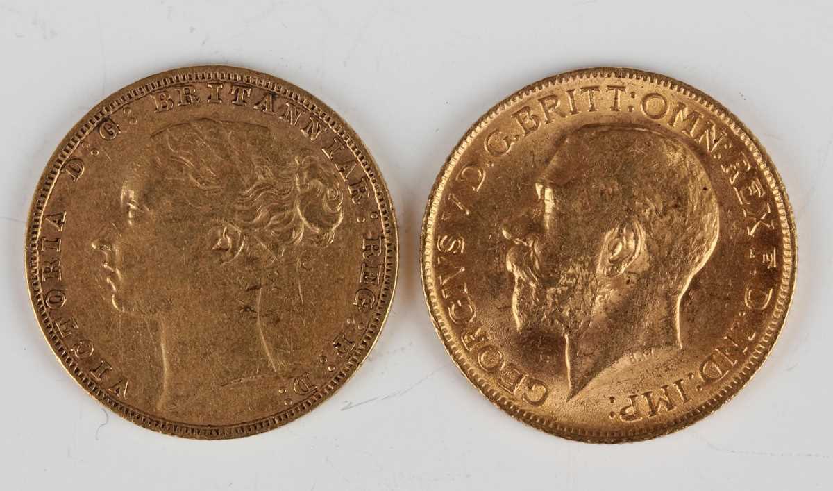 A Victoria Young Head sovereign 1884 and a George V sovereign 1911.