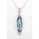 A synthetic blue spinel and diamond pendant, claw set with the large oval cut synthetic blue