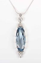 A synthetic blue spinel and diamond pendant, claw set with the large oval cut synthetic blue