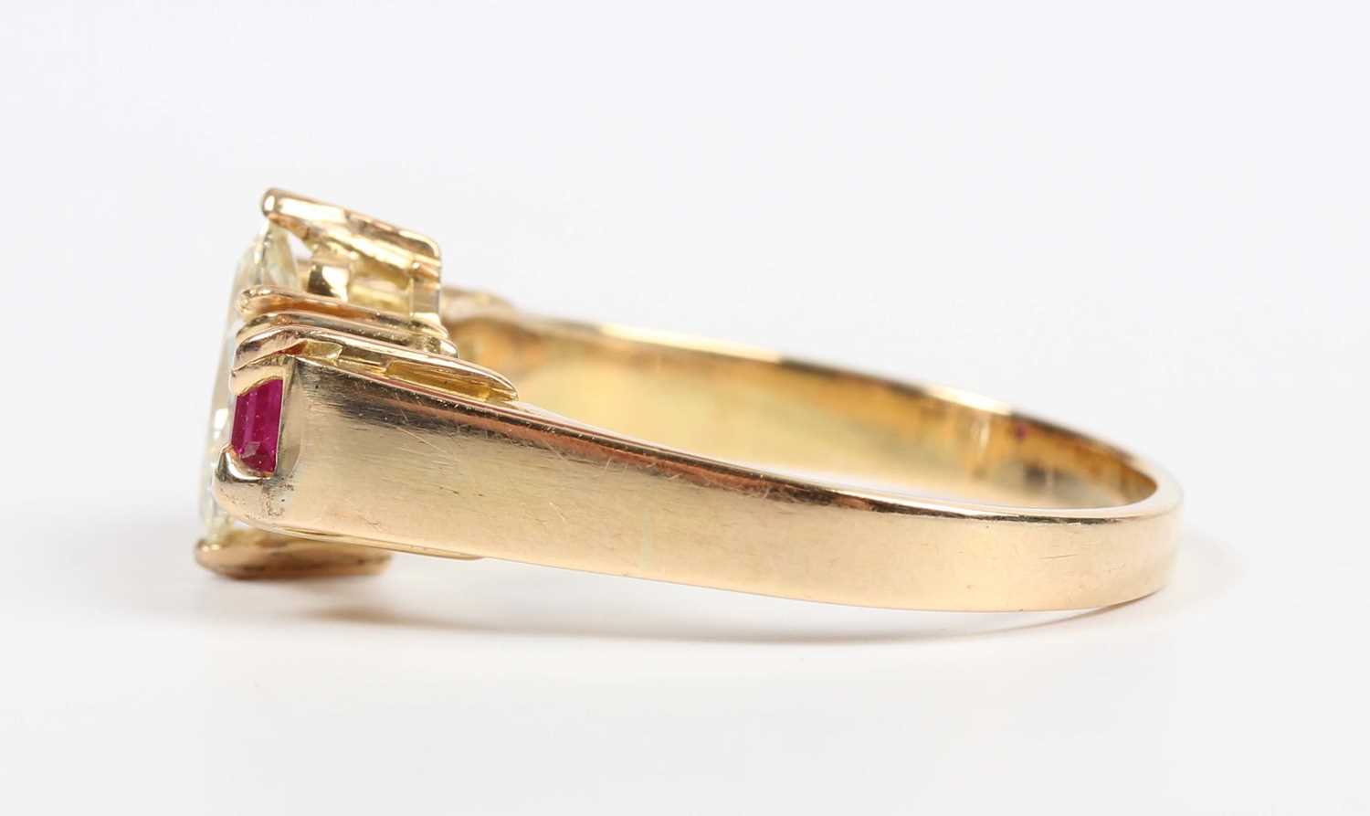 A gold, diamond and ruby ring, claw set with the marquise shaped diamond between two square cut - Image 3 of 5