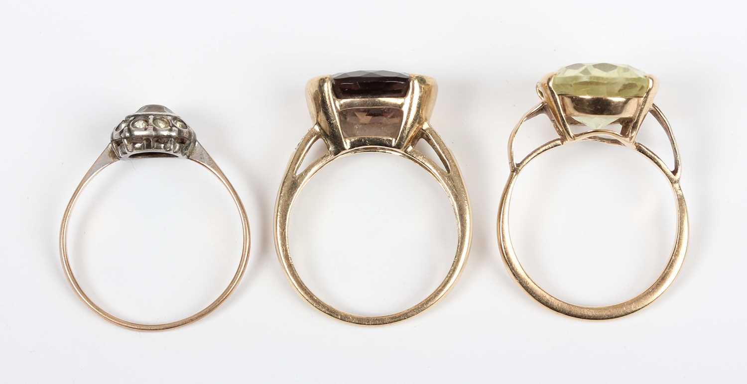 A gold, smoky quartz and diamond ring, mounted with an oval cut smoky quartz between diamond four - Image 4 of 4