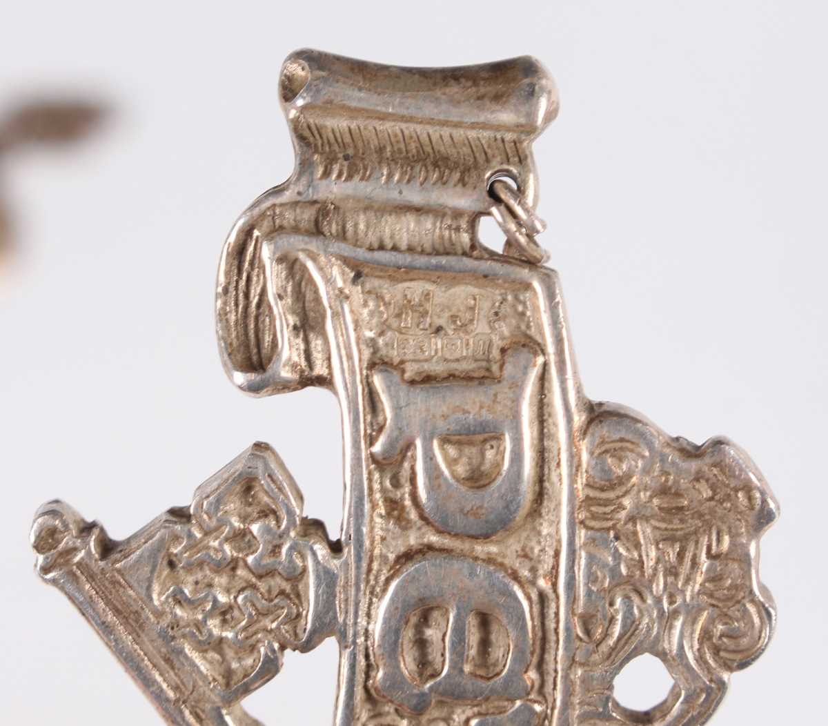 An Elizabeth II 'The Hugh Johnson Collection' silver cast decanter label, designed as the Pétrus - Image 4 of 9