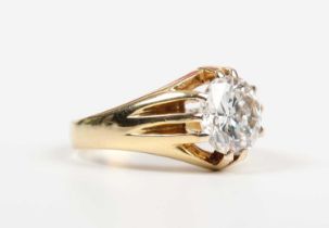 A gold and diamond single stone ring, claw set with a circular cut diamond, unmarked, weight 5.4g,