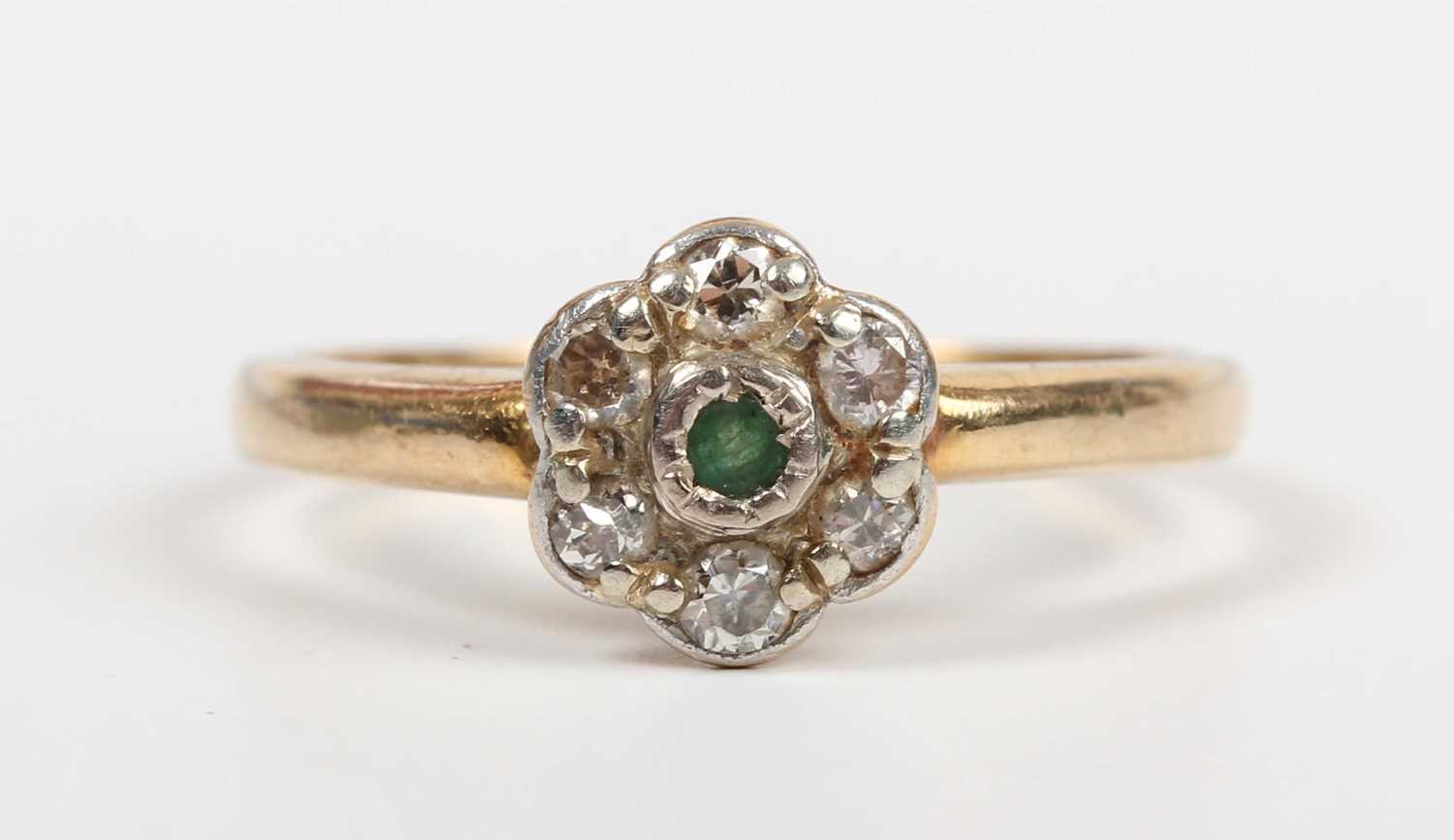 A gold and platinum, emerald and diamond cluster ring, mounted with the circular cut emerald - Image 2 of 5