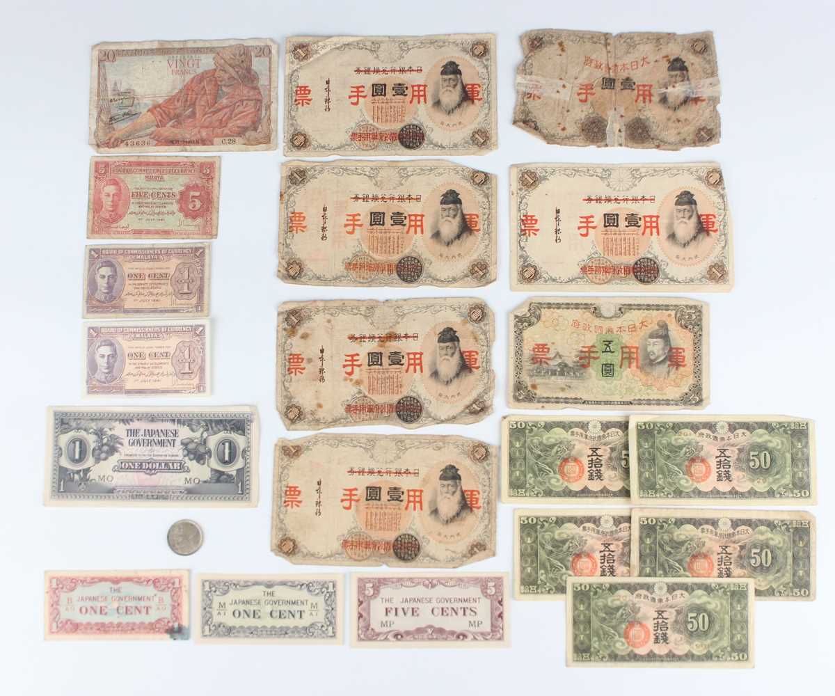 A small collection of Chinese and Japanese banknotes, four other banknotes and a China Kwangtung