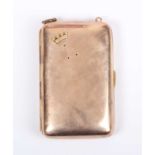 A late Victorian 9ct gold curved rectangular cigarette case, the front applied with a crown motif,