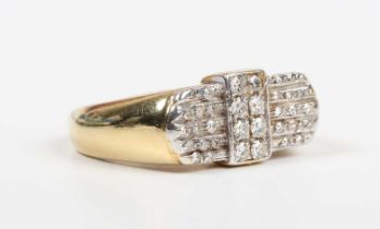 A gold and diamond ring, mounted with eight circular cut diamonds in a rectangular shaped setting