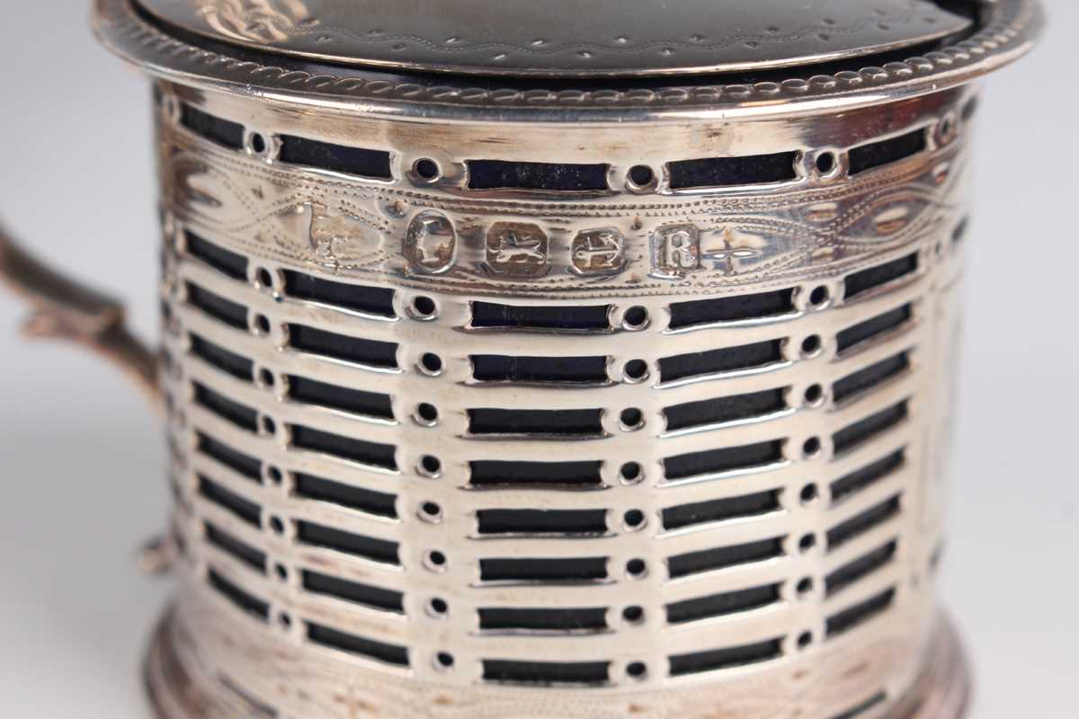 A Victorian silver pierced cylindrical mustard with hinged lid and pierced thumbpiece, flanked by - Image 3 of 3