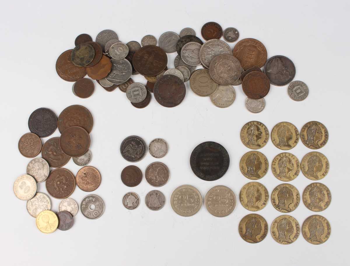 A collection of European and world coins and tokens, including a small group of USA coins, including