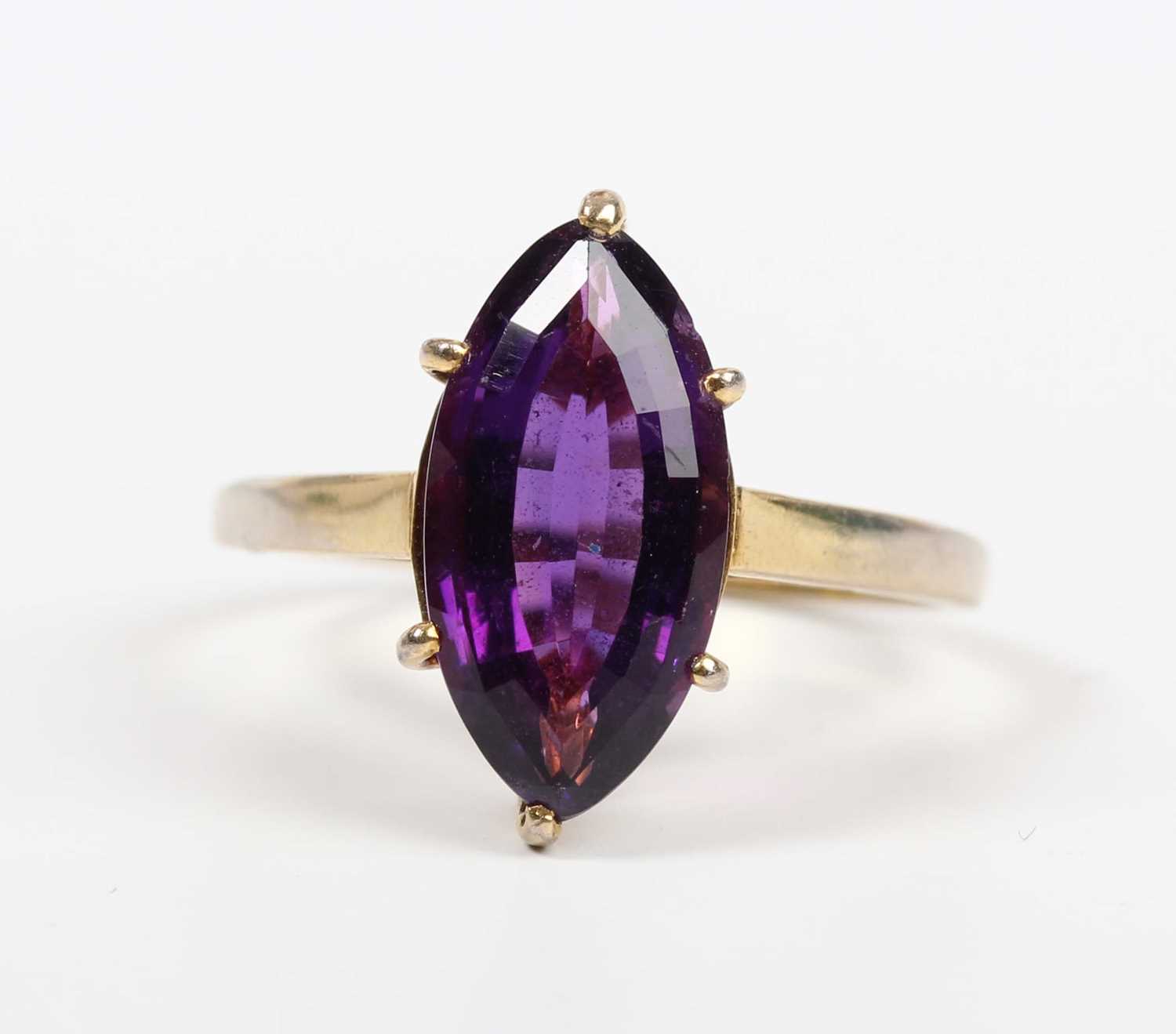 An 18ct gold ring, claw set with a marquise shaped amethyst, London 1985, weight 3.8g, ring size - Image 2 of 5